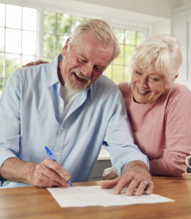 Smiling parents after their child learned how to get a power of attorney for their parent with dementia before it is too late.