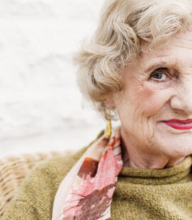 An elderly woman smiling after receiving private fiduciary services that enabled her to make the most of her retirement.