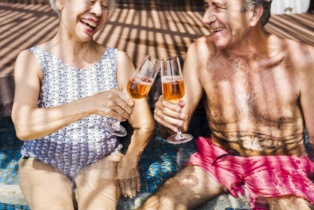 Seniors smiling and enjoying retirement because their children hired a private professional fiduciary after answering the question, What are the financial needs of an elderly person?
